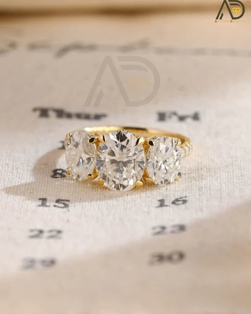Discover our Three Stone Oval Cut Moissanite Engagement Ring, featuring a classic and unique design. Perfect for expressing your love with timeless elegance!