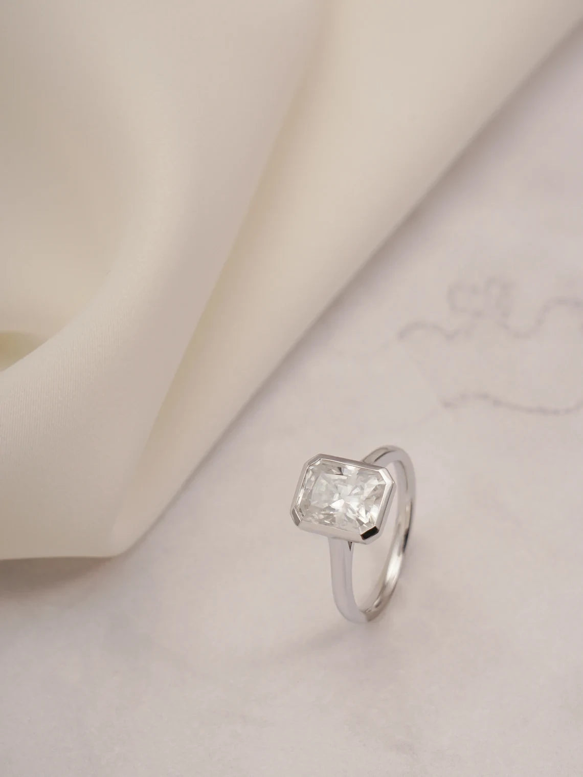 bezel setting moissanite | white gold engagement ring | radiant cut solitaire