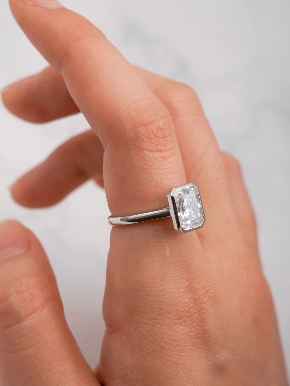 radiant cut white gold ring | bezel moissanite setting | conflict free diamond