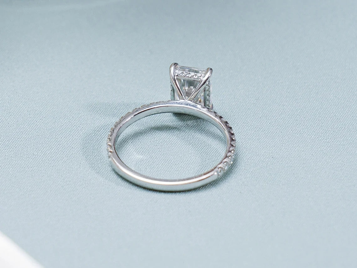 Elegant radiant cut moissanite engagement ring in 14K gold with hidden halo design. A sparkling and timeless ring, perfect for a forever promise.