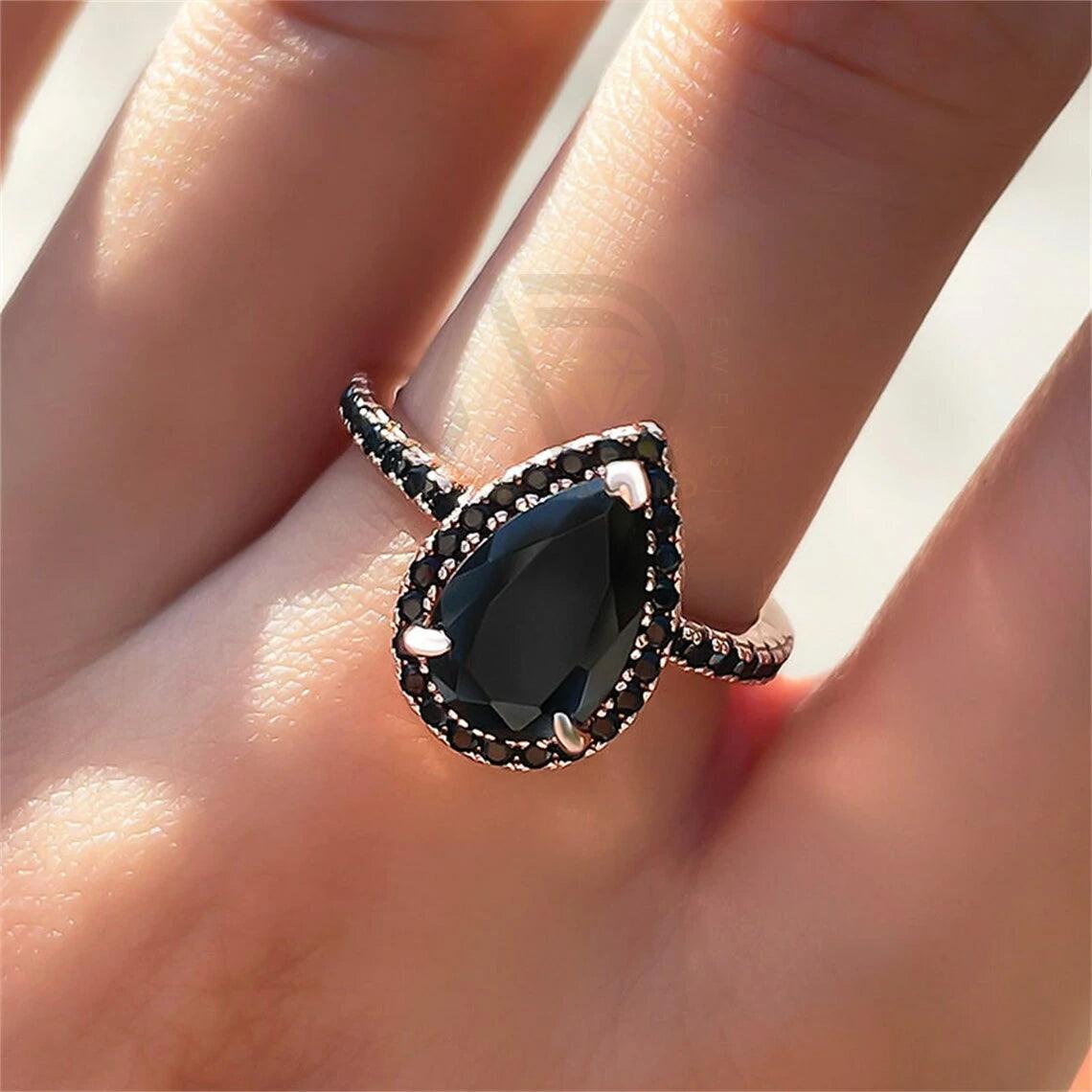 pear diamond ring, pear moissanite ring, halo bridal ring, pear wedding ring, halo promise ring, vintage pear ring, elegant pear ring, unique pear ring, classic pear ring, custom pear ring, gold pear ring, platinum pear ring, silver pear ring, pear eternity ring, pear three stone ring, halo anniversary ring, luxury pear ring, dainty pear ring, simple pear ring