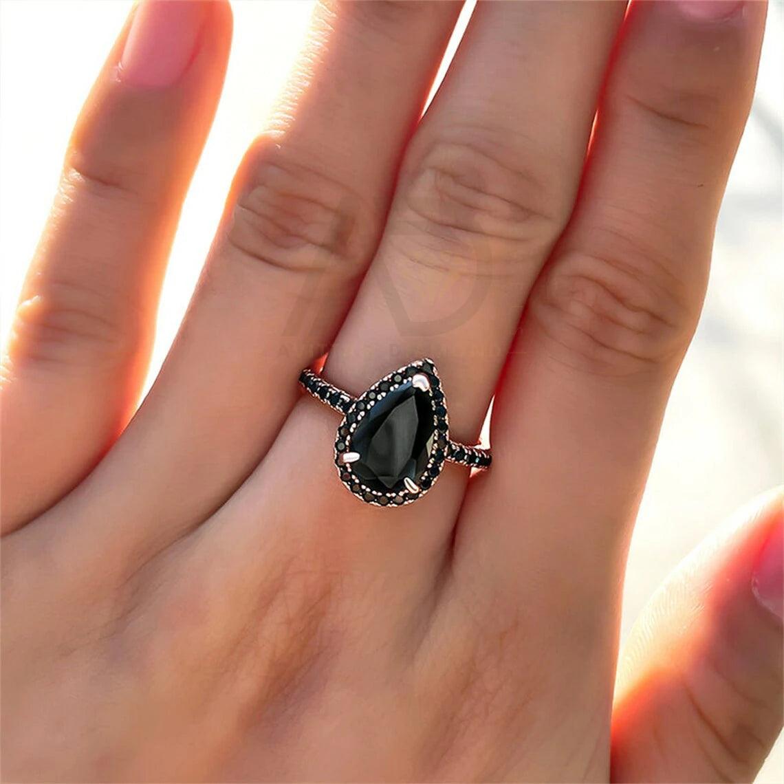 pear diamond ring, pear moissanite ring, halo bridal ring, pear wedding ring, halo promise ring, vintage pear ring, elegant pear ring, unique pear ring, classic pear ring, custom pear ring, gold pear ring, platinum pear ring, silver pear ring, pear eternity ring, pear three stone ring, halo anniversary ring, luxury pear ring, dainty pear ring, simple pear ring