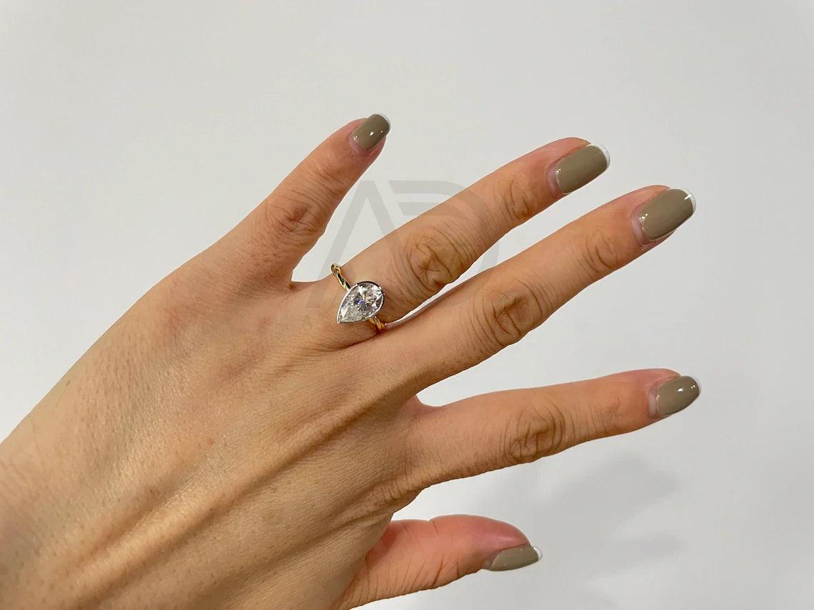 Pear Engagement, Elegant Ring, Bridal Jewelry, Teardrop Ring, Precious Stone, Unique Engagement, Custom Ring, Proposal Ring, Dainty Ring, Classic Jewelry, Handcrafted Ring, Designer Ring, Pear Shaped, Romantic Ring, Sparkling Gem, Wedding Ring, Bespoke Jewelry, Heartfelt Gift, Timeless Piece, Delicate Ring, Exquisite Design, Fine Jewelry, Gemstone Ring, Trendy Ring, Heirloom Quality, Modern Engagement, Artisan Ring, Forever Ring, Love Symbol, Stylish Jewelry