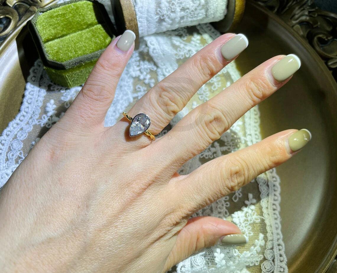 Pear Engagement, Elegant Ring, Bridal Jewelry, Teardrop Ring, Precious Stone, Unique Engagement, Custom Ring, Proposal Ring, Dainty Ring, Classic Jewelry, Handcrafted Ring, Designer Ring, Pear Shaped, Romantic Ring, Sparkling Gem, Wedding Ring, Bespoke Jewelry, Heartfelt Gift, Timeless Piece, Delicate Ring, Exquisite Design, Fine Jewelry, Gemstone Ring, Trendy Ring, Heirloom Quality, Modern Engagement, Artisan Ring, Forever Ring, Love Symbol, Stylish Jewelry
