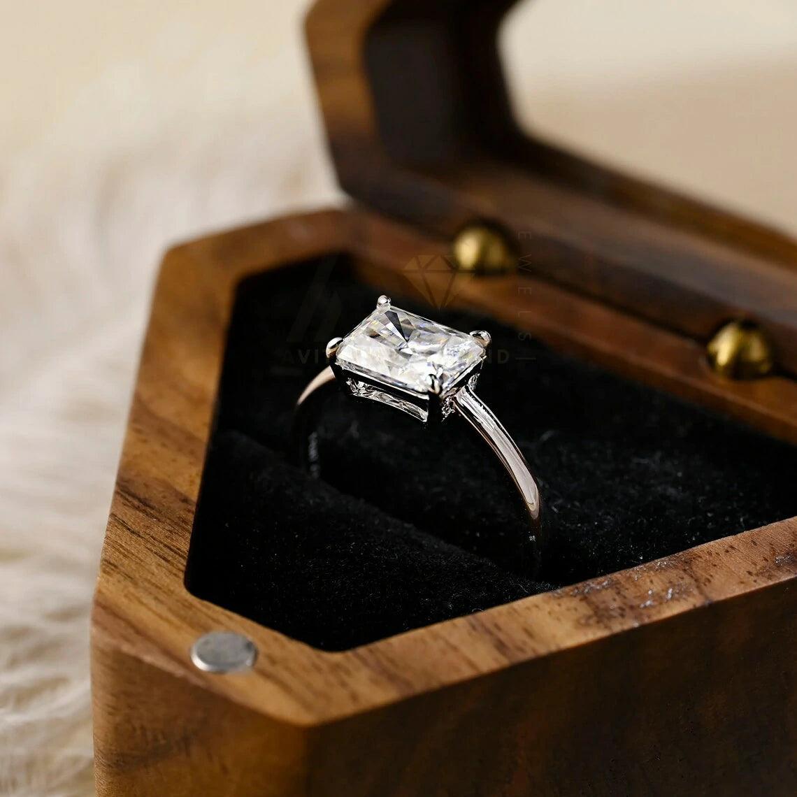 Discover elegance with our West to East Radiant Cut Solitaire Moissanite Engagement Ring. Crafted with a 3.00-carat radiant-cut moissanite diamond, Perfect for weddings or anniversaries. Shop now!