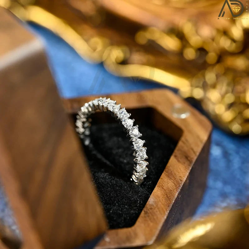 Discover our stunning Heart Cut Full Eternity Wedding Band, perfect for proposals and as a matching band. This beautiful design symbolizes everlasting love and makes a heartfelt Christmas gift.