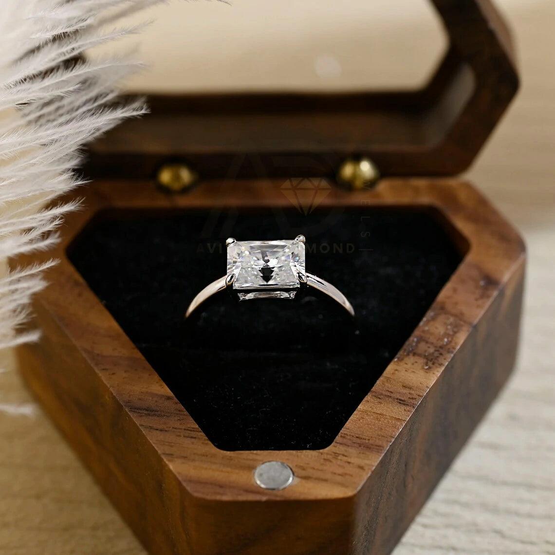 Discover elegance with our West to East Radiant Cut Solitaire Moissanite Engagement Ring. Crafted with a 3.00-carat radiant-cut moissanite diamond, Perfect for weddings or anniversaries. Shop now!
