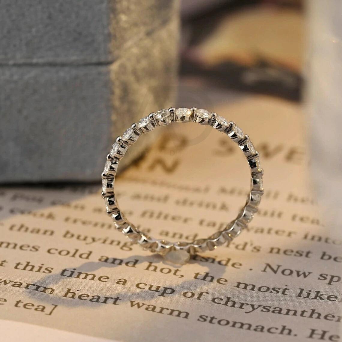 Certainly! Here are more SEO tags for your title: Round moissanite band, Solid gold wedding band, Moissanite eternity band, Bridal jewelry, Anniversary ring, Eternity wedding band, Gold bridal band, Matching moissanite band, Customizable wedding band, Sparkling bridal jewelry
