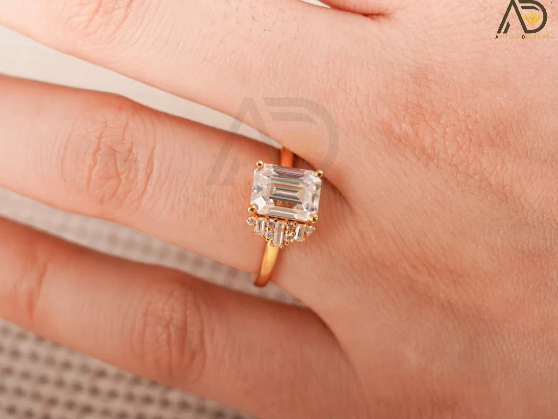 Celebrate love with this beautiful 10K/14K/18K Solid Gold Emerald Cut Moissanite Engagement Ring. Its dainty cluster design is perfect for engagements, anniversaries, or as a thoughtful birthday gift for her.