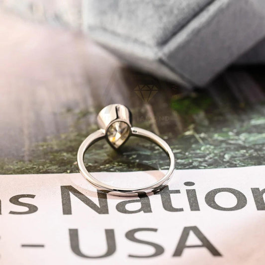 halo pear ring, pear engagement ring, pear halo ring, halo diamond ring, halo moissanite ring, pear cut ring, pear diamond ring, pear moissanite ring, halo bridal ring, pear wedding ring, halo promise ring, vintage pear ring, elegant pear ring, unique pear ring, classic pear ring, custom pear ring, gold pear ring, platinum pear ring, silver pear ring, pear eternity ring,