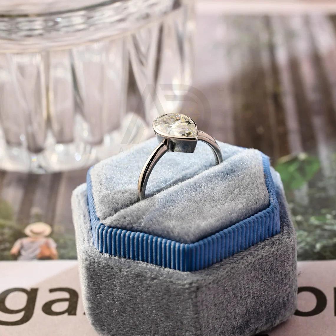 halo pear ring, pear engagement ring, pear halo ring, halo diamond ring, halo moissanite ring, pear cut ring, pear diamond ring, pear moissanite ring, halo bridal ring, pear wedding ring, halo promise ring, vintage pear ring, elegant pear ring, unique pear ring, classic pear ring, custom pear ring, gold pear ring, platinum pear ring, silver pear ring, pear eternity ring,