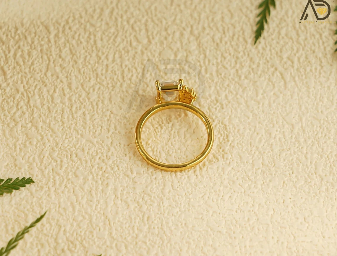 Celebrate love with this beautiful 10K/14K/18K Solid Gold Emerald Cut Moissanite Engagement Ring. Its dainty cluster design is perfect for engagements, anniversaries, or as a thoughtful birthday gift for her.