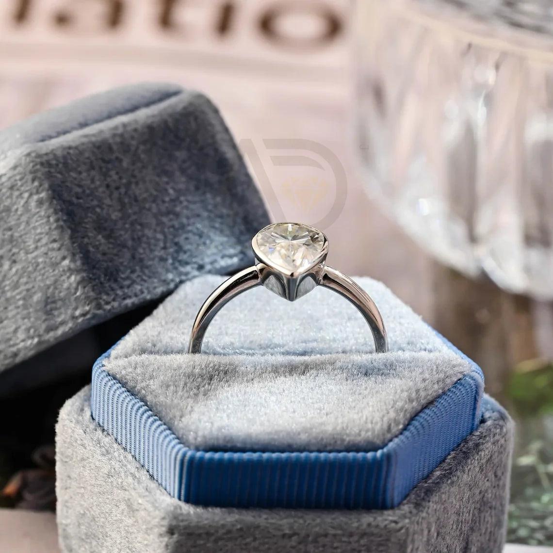halo pear ring, pear engagement ring, pear halo ring, halo diamond ring, halo moissanite ring, pear cut ring, pear diamond ring, pear moissanite ring, halo bridal ring, pear wedding ring, halo promise ring, vintage pear ring, elegant pear ring, unique pear ring, classic pear ring, custom pear ring, gold pear ring, platinum pear ring, silver pear ring, pear eternity ring,