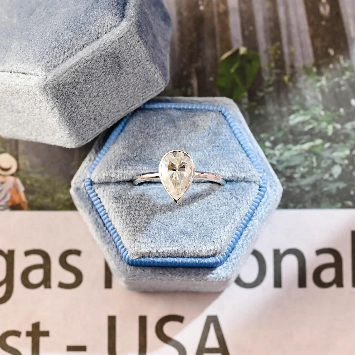 halo pear ring, pear engagement ring, pear halo ring, halo diamond ring, halo moissanite ring, pear cut ring, pear diamond ring, pear moissanite ring, halo bridal ring, pear wedding ring, halo promise ring, vintage pear ring, elegant pear ring, unique pear ring, classic pear ring, custom pear ring, gold pear ring, platinum pear ring, silver pear ring, pear eternity ring,