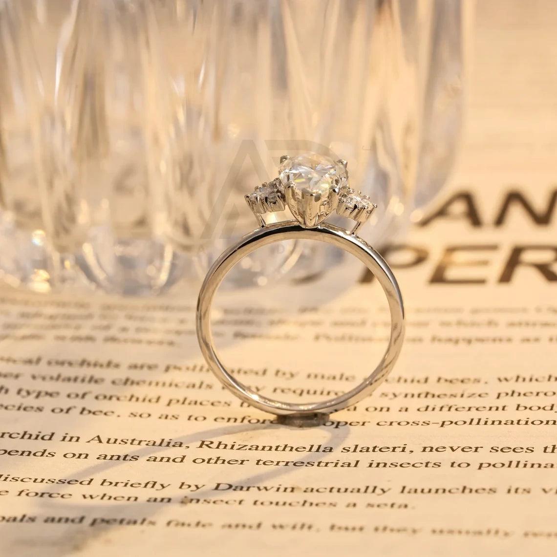 Pear Moissanite Engagement Ring, Teardrop Shaped Moissanite Ring, Round Accent Stone Ring, Solid Gold Promise Ring, Anniversary Gift for Women, Customizable Fine Jewelry, Unique Wedding Band, Luxurious Symbol of Love, Timeless Elegance, Romantic Anniversary Jewelry