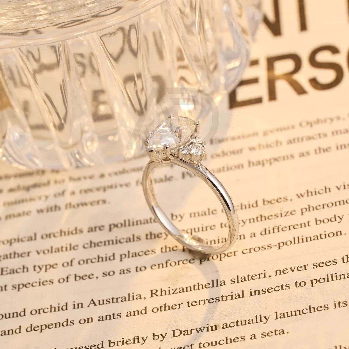 Pear Moissanite Engagement Ring, Teardrop Shaped Moissanite Ring, Round Accent Stone Ring, Solid Gold Promise Ring, Anniversary Gift for Women, Customizable Fine Jewelry, Unique Wedding Band, Luxurious Symbol of Love, Timeless Elegance, Romantic Anniversary Jewelry