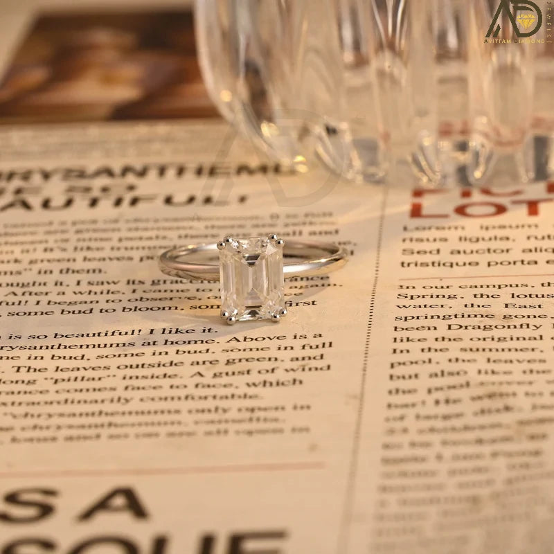 This stunning colorless Moissanite ring showcases a timeless emerald cut design, making it an ideal choice for any bride. Handcrafted and affordable luxury.