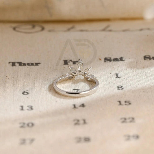 marquise wedding band, moissanite ring, wedding jewelry, bridal band, diamond alternative, anniversary gift, gold band, silver band, platinum band, handcrafted ring, dainty jewelry, elegant design, timeless beauty, luxury ring, custom made, fine jewelry, sparkling gemstone, modern elegance, statement piece, designer band, unique design, high-quality craftsmanship, affordable luxury