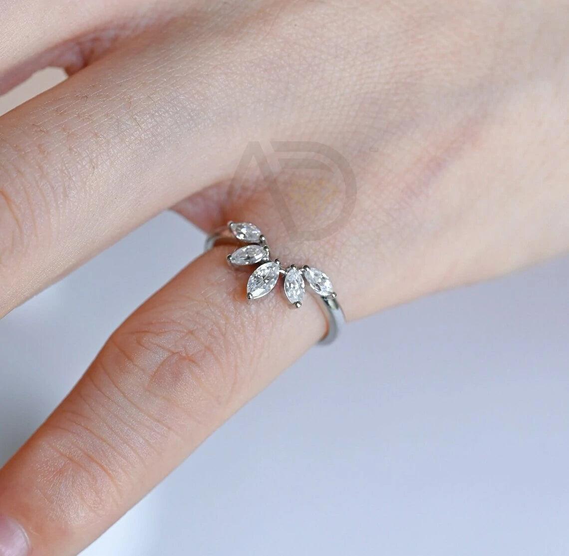 marquise wedding band, moissanite ring, wedding jewelry, bridal band, diamond alternative, anniversary gift, gold band, silver band, platinum band, handcrafted ring, dainty jewelry, elegant design, timeless beauty, luxury ring, custom made, fine jewelry, sparkling gemstone, modern elegance, statement piece, designer band, unique design, high-quality craftsmanship, affordable luxury