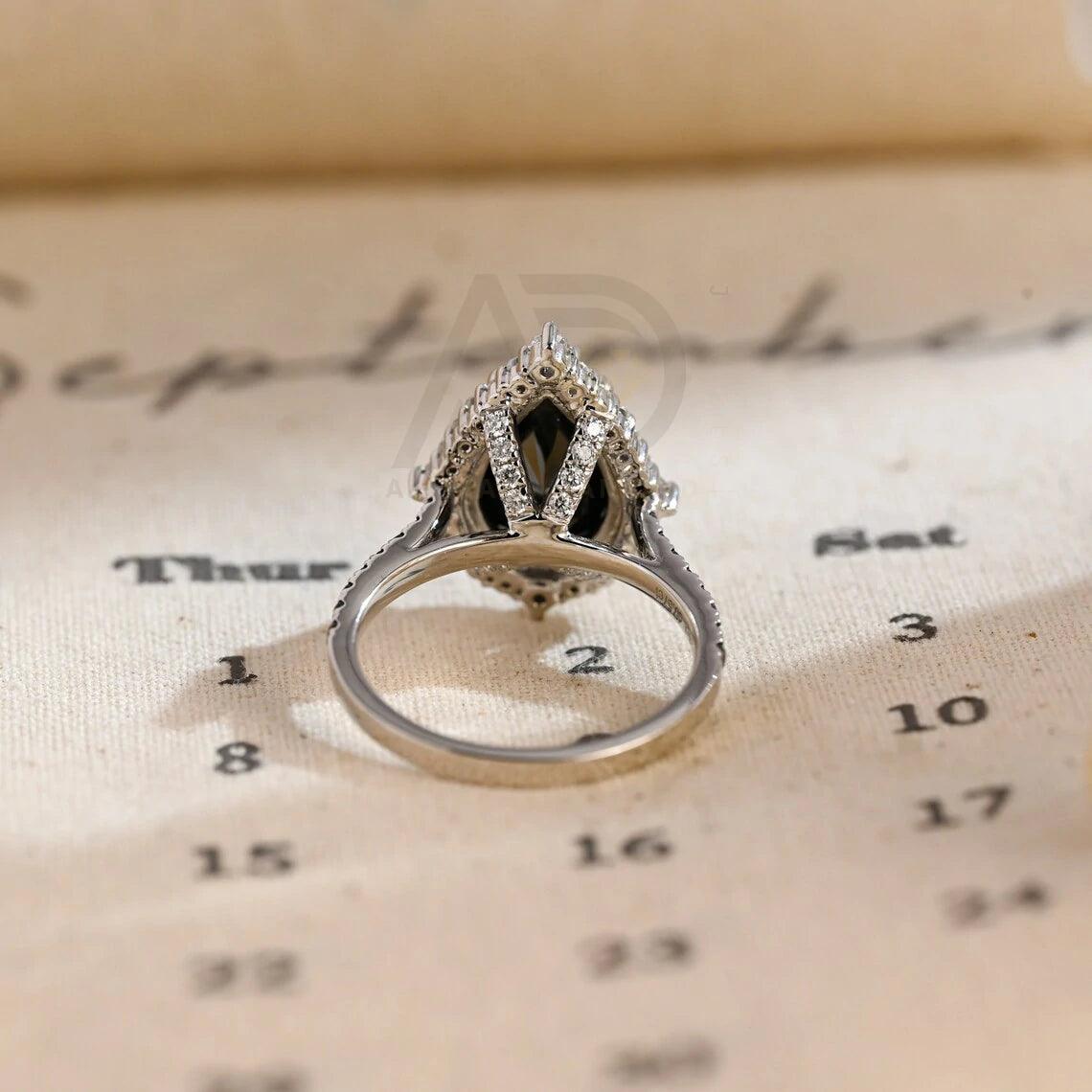 halo pear ring, pear engagement ring, pear halo ring, halo diamond ring, halo moissanite ring, pear cut ring, pear diamond ring, pear moissanite ring, halo bridal ring, pear wedding ring, halo promise ring, vintage pear ring, elegant pear ring, unique pear ring, classic pear ring, custom pear ring, gold pear ring, platinum pear ring, silver pear ring, pear eternity ring, pear three stone ring, halo anniversary ring, luxury pear ring, dainty pear ring, simple pear ring