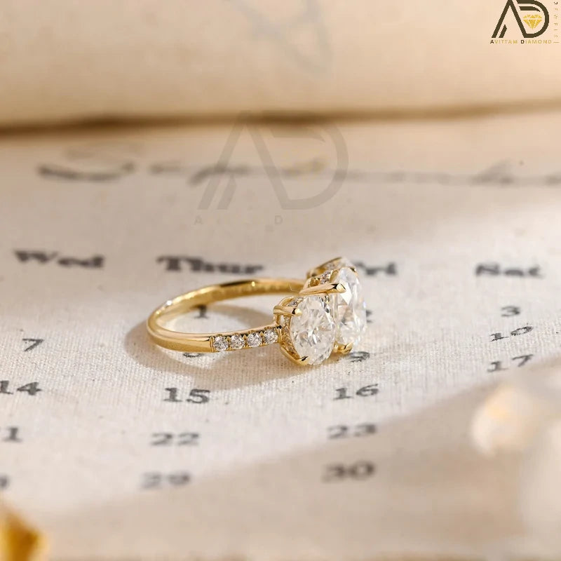 Discover our Three Stone Oval Cut Moissanite Engagement Ring, featuring a classic and unique design. Perfect for expressing your love with timeless elegance!