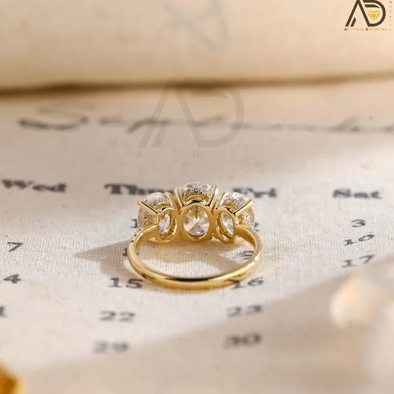 Discover our Three Stone Oval Cut Moissanite Engagement Ring, featuring a classic and unique design. Perfect for expressing your love with timeless elegance!