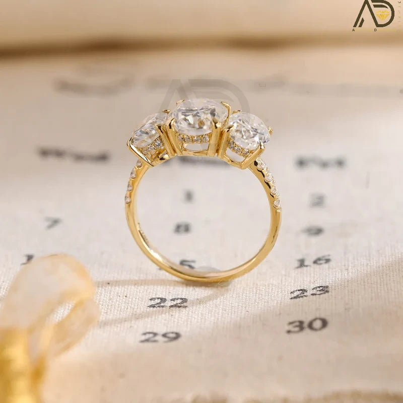 Discover our Three Stone Oval Cut Moissanite Engagement Ring, featuring a classic and unique design. Perfect for expressing your love with timeless elegance!