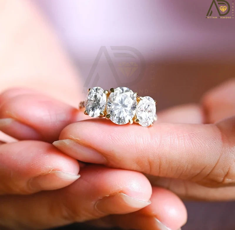 Discover our Three Stone Oval Cut Moissanite Engagement Ring, featuring a classic and unique design. Perfect for expressing your love with timeless elegance!