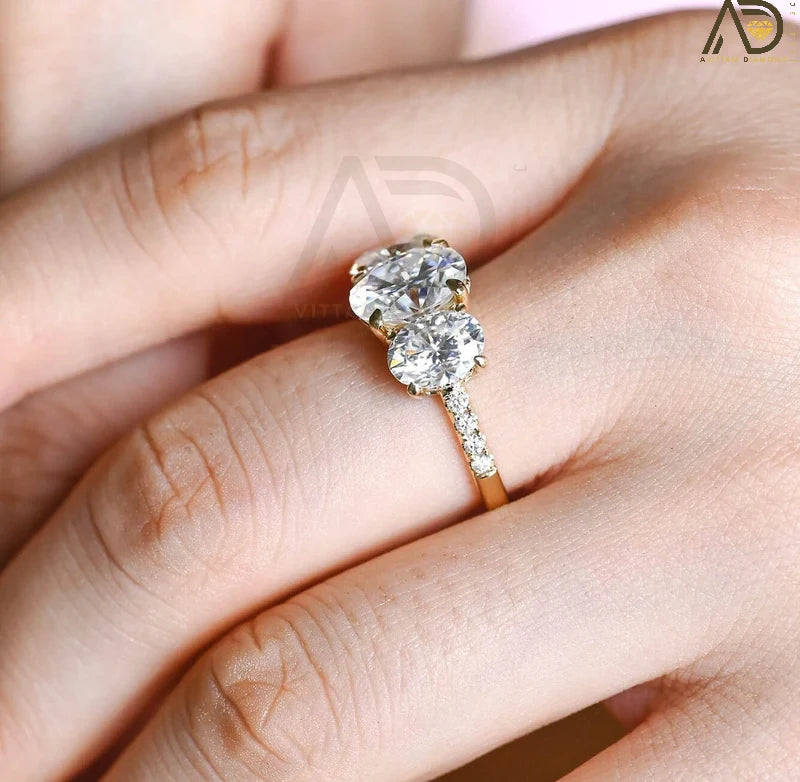 Discover our Three Stone Oval Cut Moissanite Engagement Ring, featuring a classic and unique design. Perfect for expressing your love with timeless elegance!