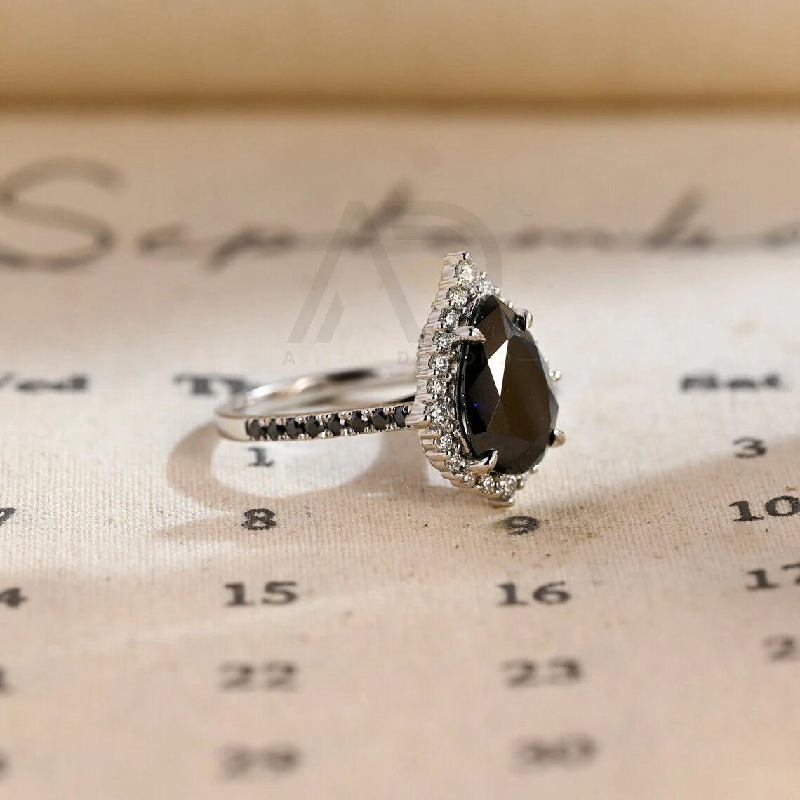 halo pear ring, pear engagement ring, pear halo ring, halo diamond ring, halo moissanite ring, pear cut ring, pear diamond ring, pear moissanite ring, halo bridal ring, pear wedding ring, halo promise ring, vintage pear ring, elegant pear ring, unique pear ring, classic pear ring, custom pear ring, gold pear ring, platinum pear ring, silver pear ring, pear eternity ring, pear three stone ring, halo anniversary ring, luxury pear ring, dainty pear ring, simple pear ring