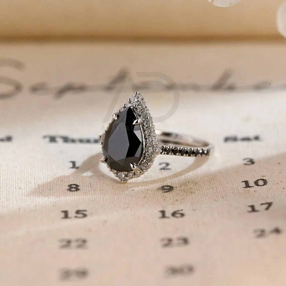 halo pear ring, pear engagement ring, pear halo ring, halo diamond ring, halo moissanite ring, pear cut ring, pear diamond ring, pear moissanite ring, halo bridal ring, pear wedding ring, halo promise ring, vintage pear ring, elegant pear ring, unique pear ring, classic pear ring, custom pear ring, gold pear ring, platinum pear ring, silver pear ring, pear eternity ring, pear three stone ring, halo anniversary ring, luxury pear ring, dainty pear ring, simple pear ring