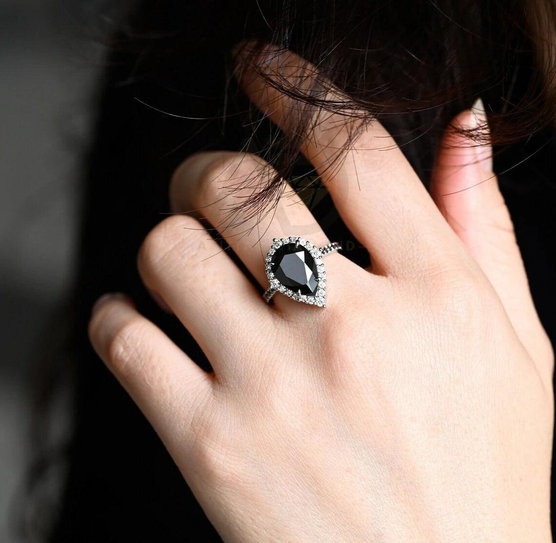 halo pear ring, pear engagement ring, pear halo ring, halo diamond ring, halo moissanite ring, pear cut ring, pear diamond ring, pear moissanite ring, halo bridal ring, pear wedding ring, halo promise ring, vintage pear ring, elegant pear ring, unique pear ring, classic pear ring, custom pear ring, gold pear ring, platinum pear ring, silver pear ring, pear eternity ring, pear three stone ring, halo anniversary ring, luxury pear ring, dainty pear ring, simple pear ring