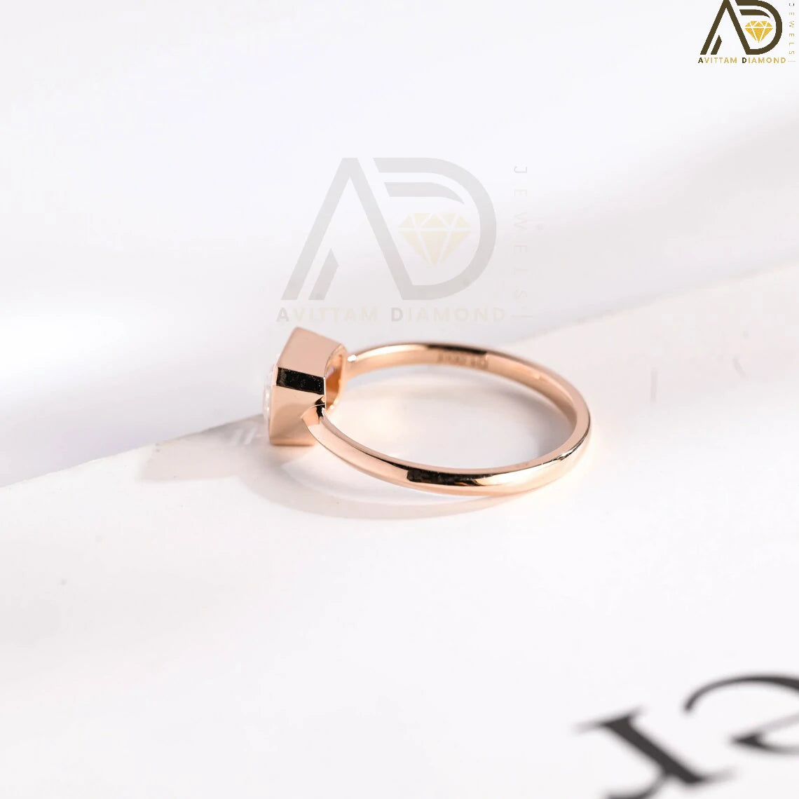 Celebrate your love with this solid gold East to West emerald cut moissanite engagement ring. Ideal for proposals, promises, anniversaries, or Christmas gifts. A stunning, timeless design for her.