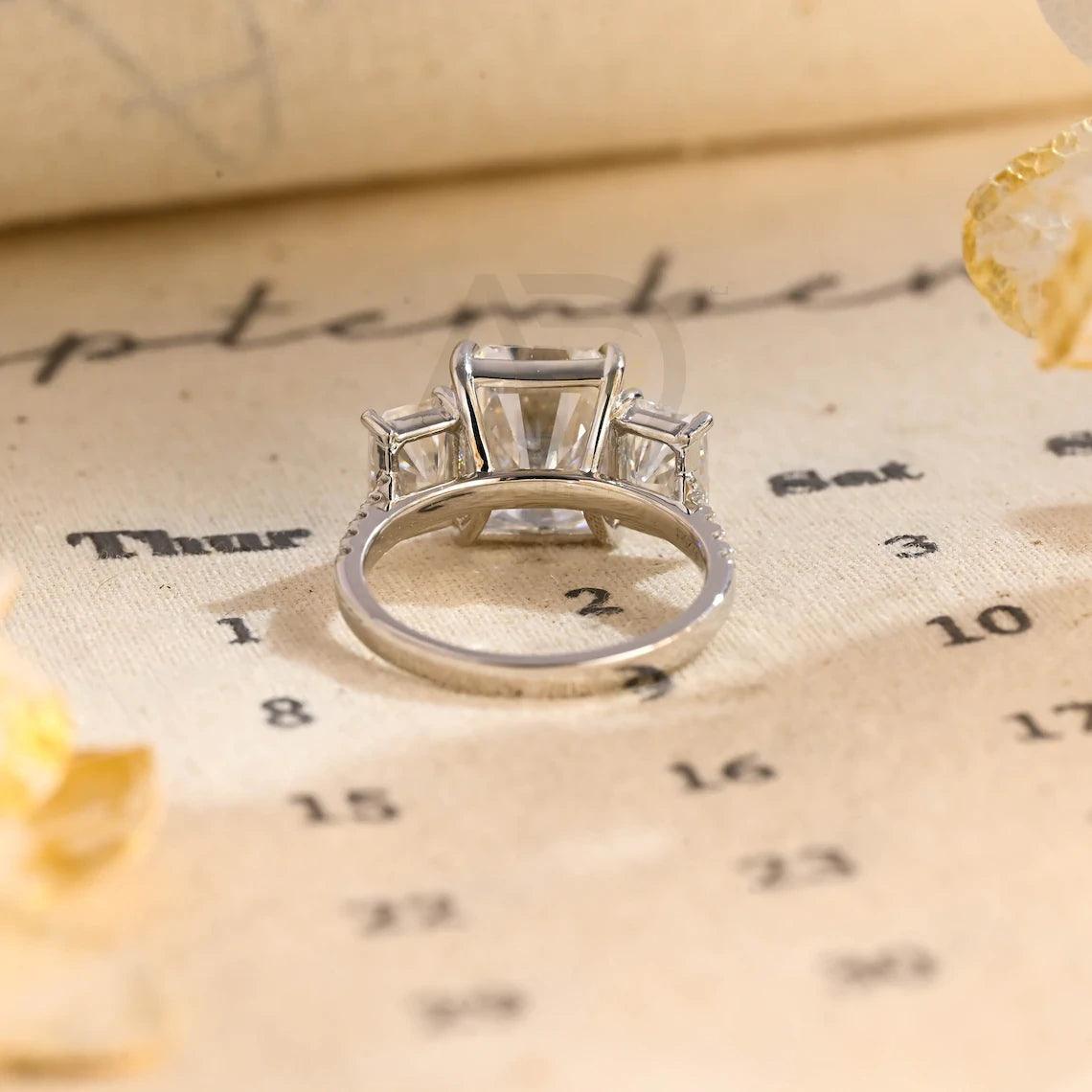 Delve into elegance and craftsmanship with our selection of Moissanite Engagement Rings, including radiant cut designs and Three Stone Wedding bands in Solid Gold. Celebrate your journey with a symbol as enduring as your love.