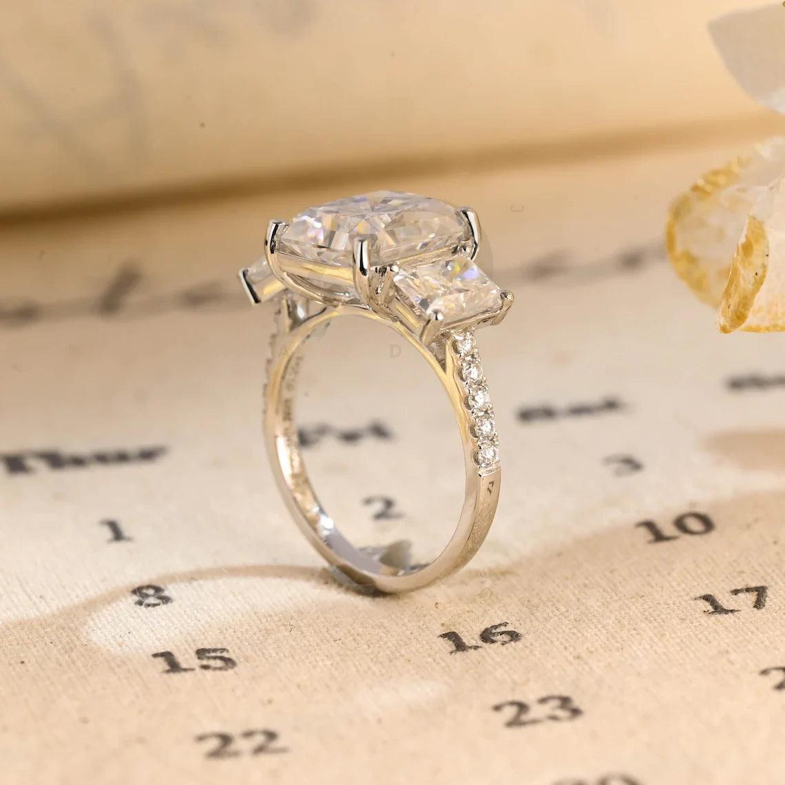 Delve into elegance and craftsmanship with our selection of Moissanite Engagement Rings, including radiant cut designs and Three Stone Wedding bands in Solid Gold. Celebrate your journey with a symbol as enduring as your love.
