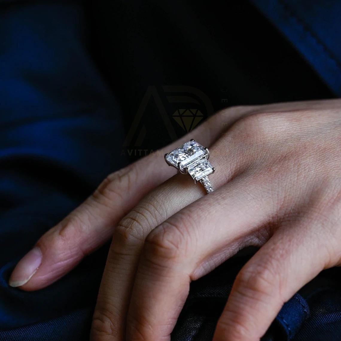 Delve into elegance and craftsmanship with our selection of Moissanite Engagement Rings, including radiant cut designs and Three Stone Wedding bands in Solid Gold. Celebrate your journey with a symbol as enduring as your love.