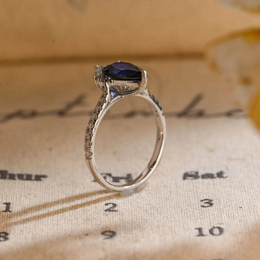 It seems like you meant "Carat Ring" instead of "Carrot Ring". Here are the SEO tags: Pear Sapphire Engagement Ring, Pave Set Cathedral Setting Solid Gold Vintage Style Pear Wedding Ring, Carat Ring Anniversary Gifts for Her, Women's Sapphire Ring, Customizable Fine Jewelry, Unique Anniversary Gift, Luxurious Symbol of Love, Timeless Elegance, Romantic Anniversary Jewelry