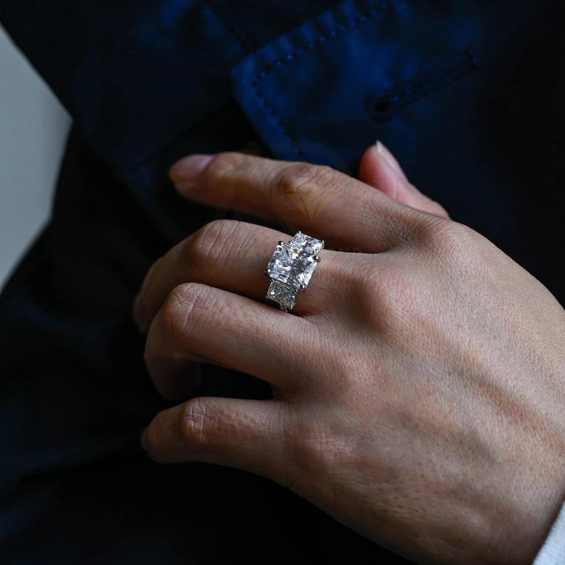 Delve into elegance and craftsmanship with our selection of Moissanite Engagement Rings, including radiant cut designs and Three Stone Wedding bands in Solid Gold. Celebrate your journey with a symbol as enduring as your love.