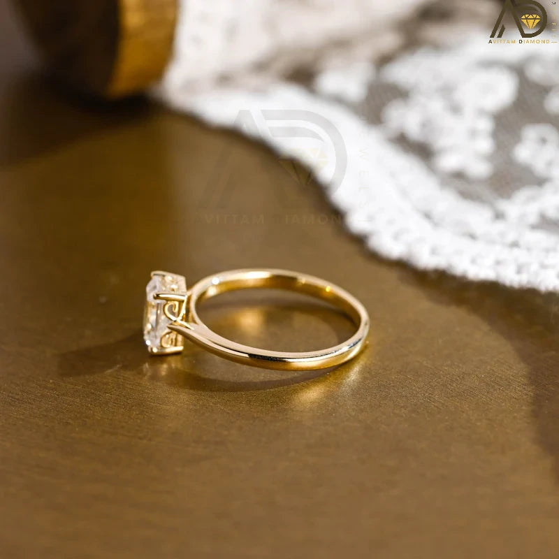 Discover our vintage style Emerald Cut Moissanite Solitaire Ring, designed to evoke timeless elegance. Perfect for engagements or as a unique gift for her.