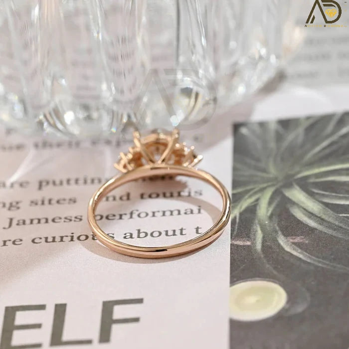 Discover our Three Stone Round Cut Moissanite Ring, a stunning choice for her engagement. Its elegant design and brilliance make it an unforgettable symbol of love.