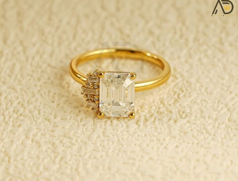 Celebrate love with this beautiful 10K/14K/18K Solid Gold Emerald Cut Moissanite Engagement Ring. Its dainty cluster design is perfect for engagements, anniversaries, or as a thoughtful birthday gift for her.