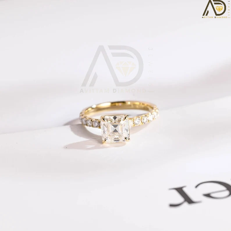 Discover our stunning Solid Gold Asscher Cut Moissanite Engagement Ring with a half pave setting. This elegant ring is the perfect anniversary gift or delicate promise ring for the special woman in your life.