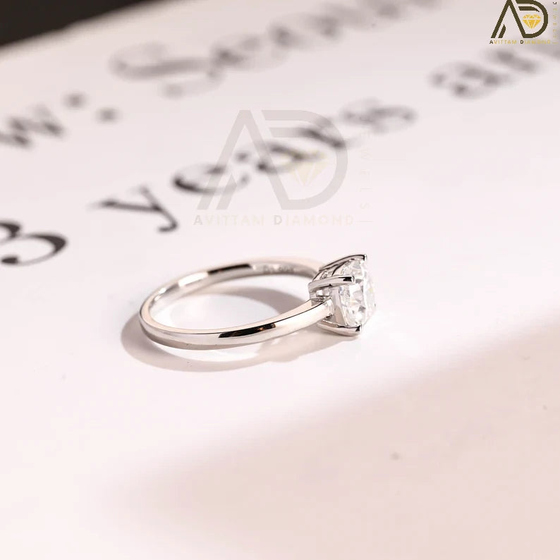 Celebrate your love with our chic Solid Gold Cushion Cut Moissanite Engagement Ring. The bar setting adds a modern touch, making it an ideal anniversary gift, promise ring, or birthday surprise for her.