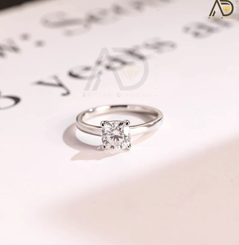 Celebrate your love with our chic Solid Gold Cushion Cut Moissanite Engagement Ring. The bar setting adds a modern touch, making it an ideal anniversary gift, promise ring, or birthday surprise for her.