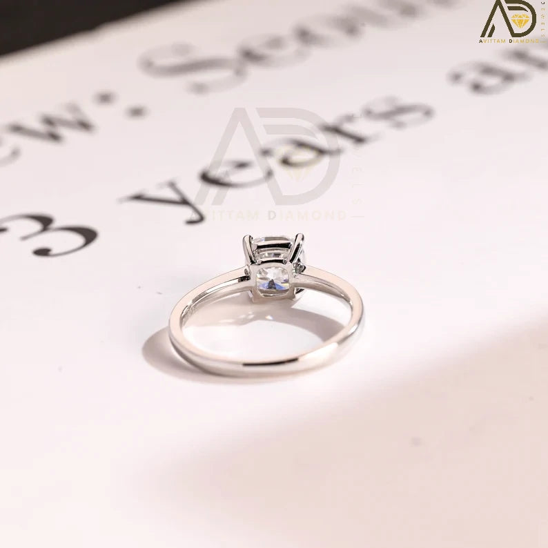 Celebrate your love with our chic Solid Gold Cushion Cut Moissanite Engagement Ring. The bar setting adds a modern touch, making it an ideal anniversary gift, promise ring, or birthday surprise for her.