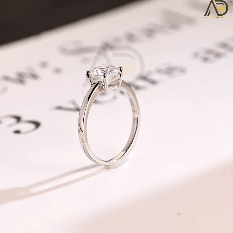 Celebrate your love with our chic Solid Gold Cushion Cut Moissanite Engagement Ring. The bar setting adds a modern touch, making it an ideal anniversary gift, promise ring, or birthday surprise for her.