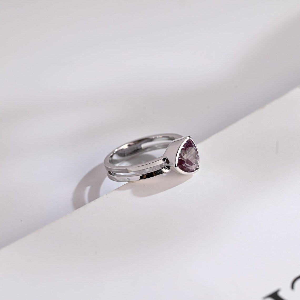 Bezel-set trillion cut diamond ring