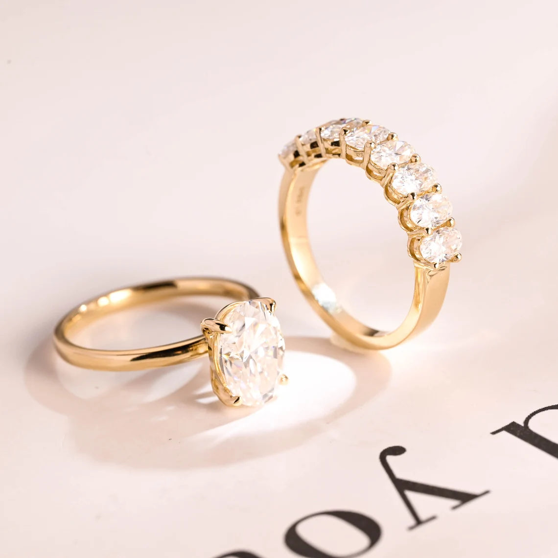 Oval half eternity wedding band