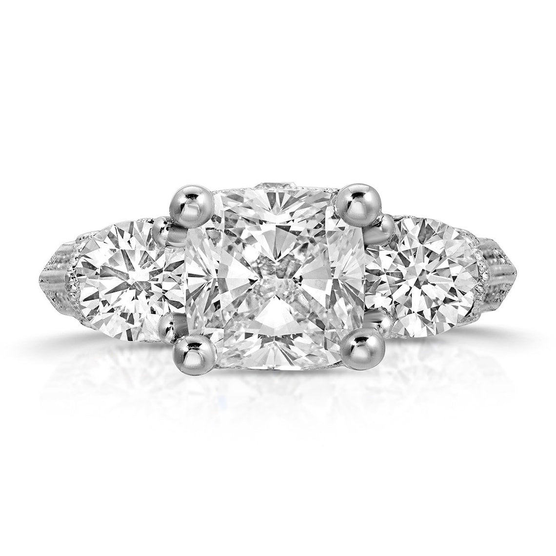 Round side stone engagement ring