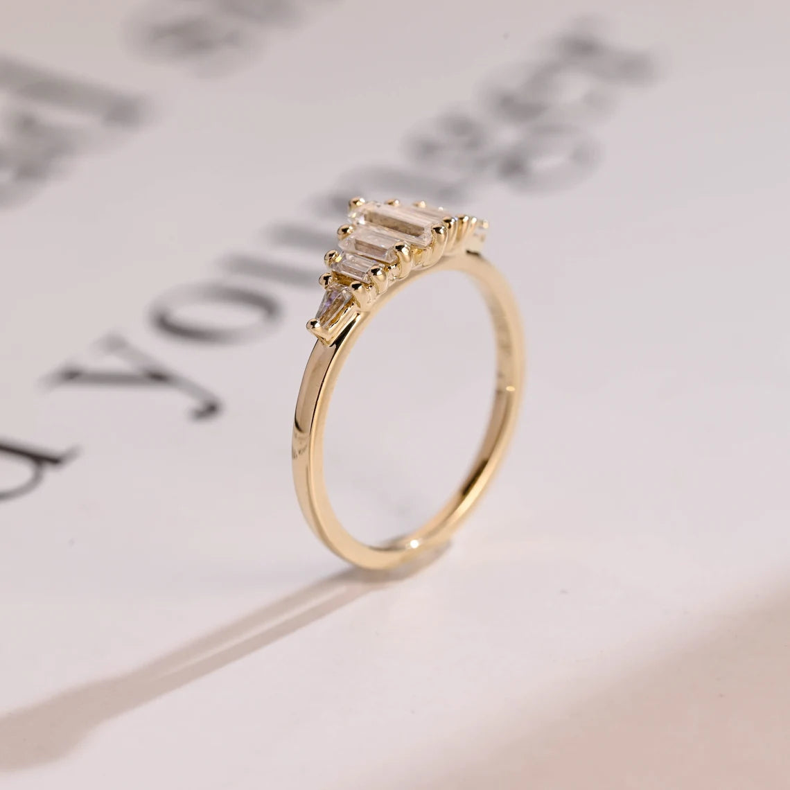 Tripod baguette moissanite ring